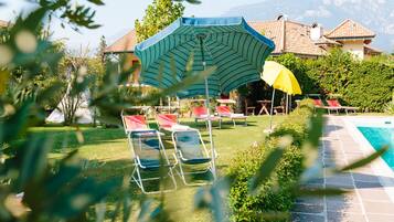 Outdoor pool, open 7:00 AM to 10:00 PM, sun loungers