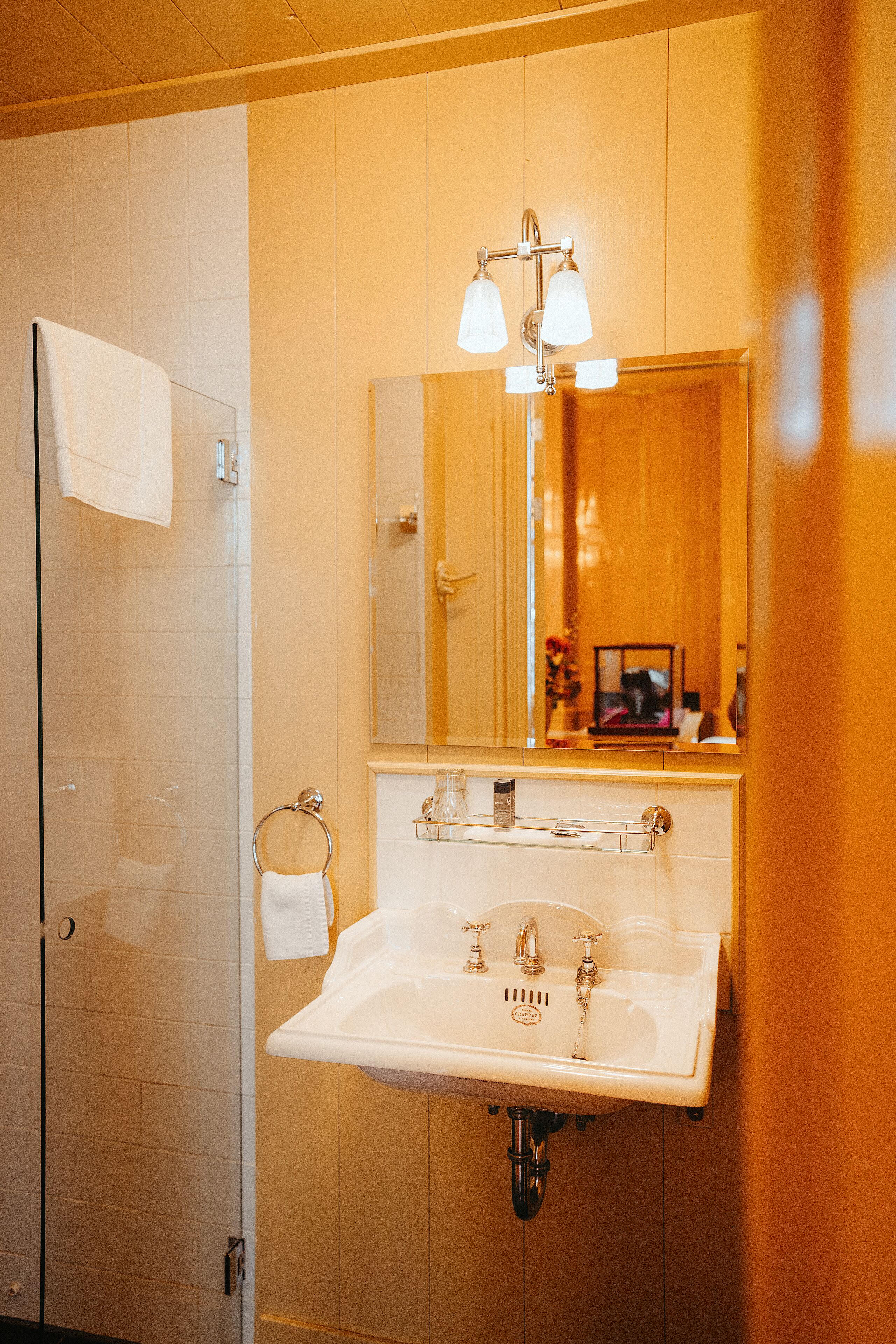 deluxe suite | bathroom | shower, rainfall showerhead, eco-friendly toiletries, hair dryer