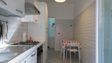 Apartment, 1 Bedroom | Private kitchen | Fridge, microwave, oven, stovetop