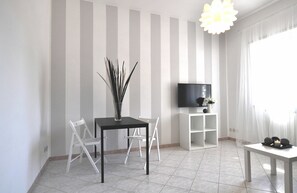 Apartment, 1 Bedroom | Living area | Flat-screen TV