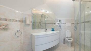 Apartment, 2 Bedrooms | Bathroom | Shower, hair dryer, slippers, bidet