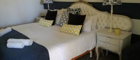 Hypo-allergenic bedding, desk, laptop workspace, blackout curtains