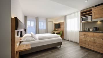 Apartamento conforto, 1 cama King | 1 quarto, roupas de cama premium, cofres nos quartos, escrivaninha