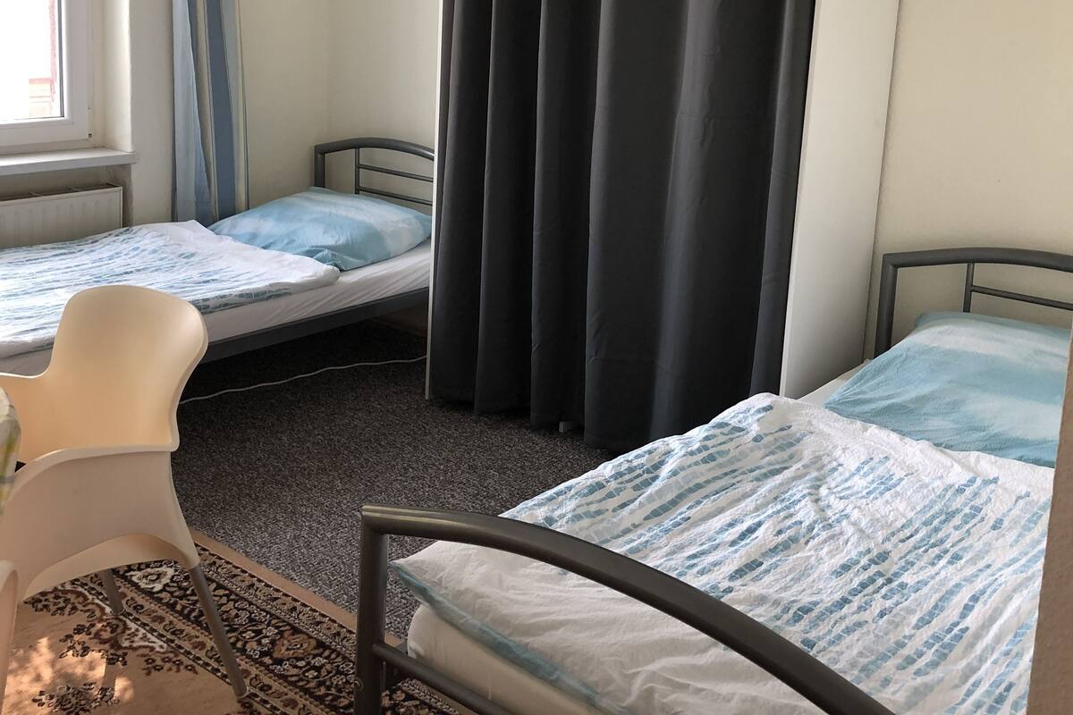 Economy Quadruple Room, Shared Bathroom | Individually decorated, individually furnished, bed sheets