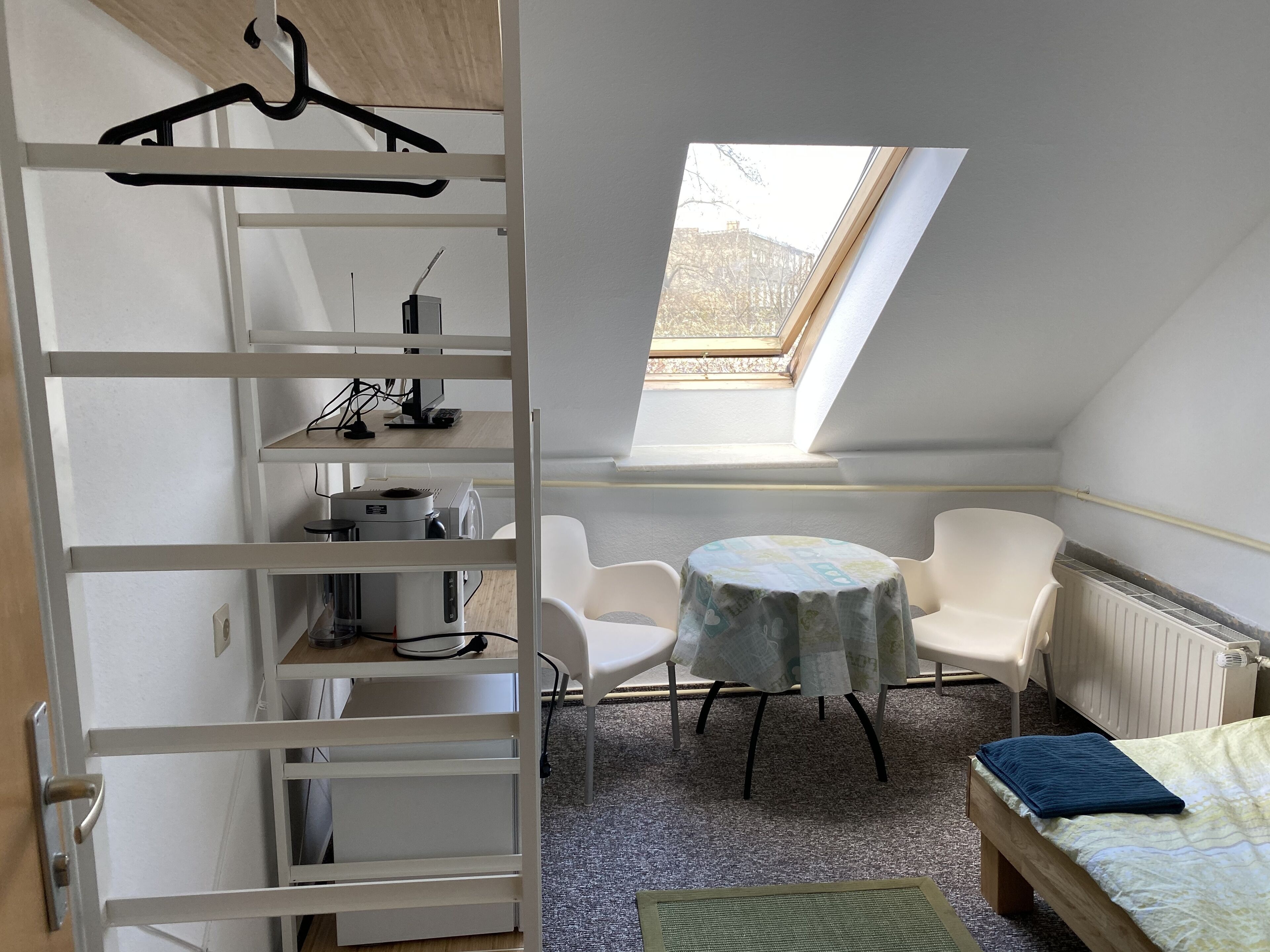 Basic Single Room, Shared Bathroom | Living area | 24-inch flat-screen TV with digital channels, TV