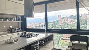 Design Condo | Private kitchen | Full-size fridge, microwave, stovetop, coffee/tea maker