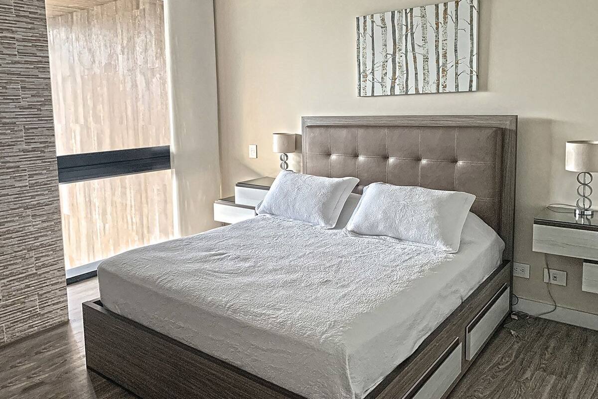 Design Condo | Premium bedding, down comforters, laptop workspace, blackout drapes