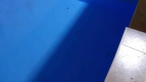 A blue-tiled swimming pool with a brown-tiled border, adjacent to a door and a staircase. - Modina Guest House (Rome)