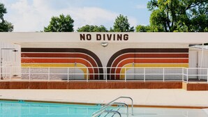 A swimming pool with a 'NO DIVING' sign above it. - The Dive Motel & Swim Club (Nashville)