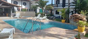 Outdoor pool, open 8:00 AM to 8:00 PM, pool umbrellas, pool loungers