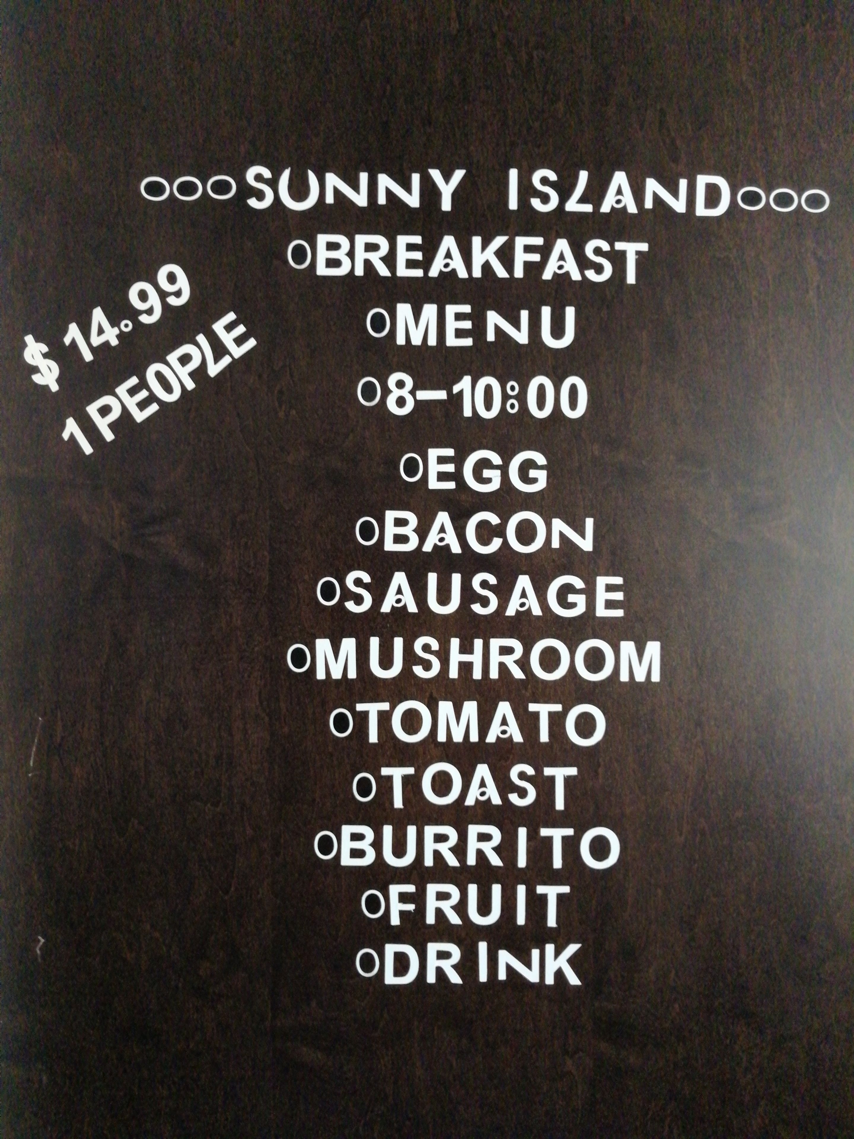A menu board for Sunny Island Breakfast with a price of $14.99 for 1 person, listing items like egg, bacon, sausage, mushroom, tomato, toast, burrito, fruit, and drink.