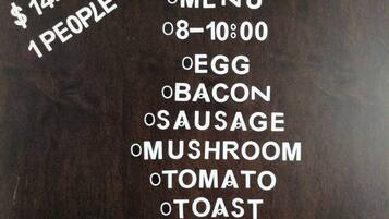 A menu board for Sunny Island Breakfast with a price of $14.99 for 1 person, listing items like egg, bacon, sausage, mushroom, tomato, toast, burrito, fruit, and drink.