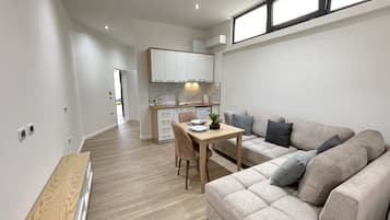 Comfort Apartment, 1 Bedroom, Balcony | Living area | 33-inch Smart TV with cable channels, heated floors