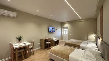 Deluxe Triple Room, Balcony, Beachside | Frette Italian sheets, premium bedding, in-room safe