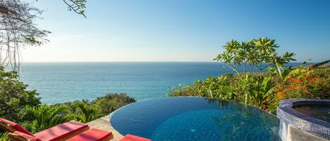 Outdoor pool, an infinity pool, sun loungers