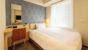 A hotel room with a bed, a desk, a chair, a mirror, a television, and a window with curtains. - Keikyu EX Inn Akihabara (Tokyo)