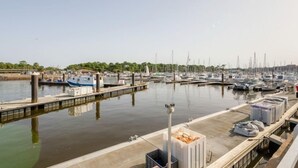 A marina with boats docked, a dock with containers, and a clear sky. - le Grand Foc by Interhome (Capbreton)