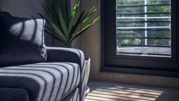 Standard Quadruple Room (Mahumhum) | Free minibar, individually decorated, desk, laptop workspace