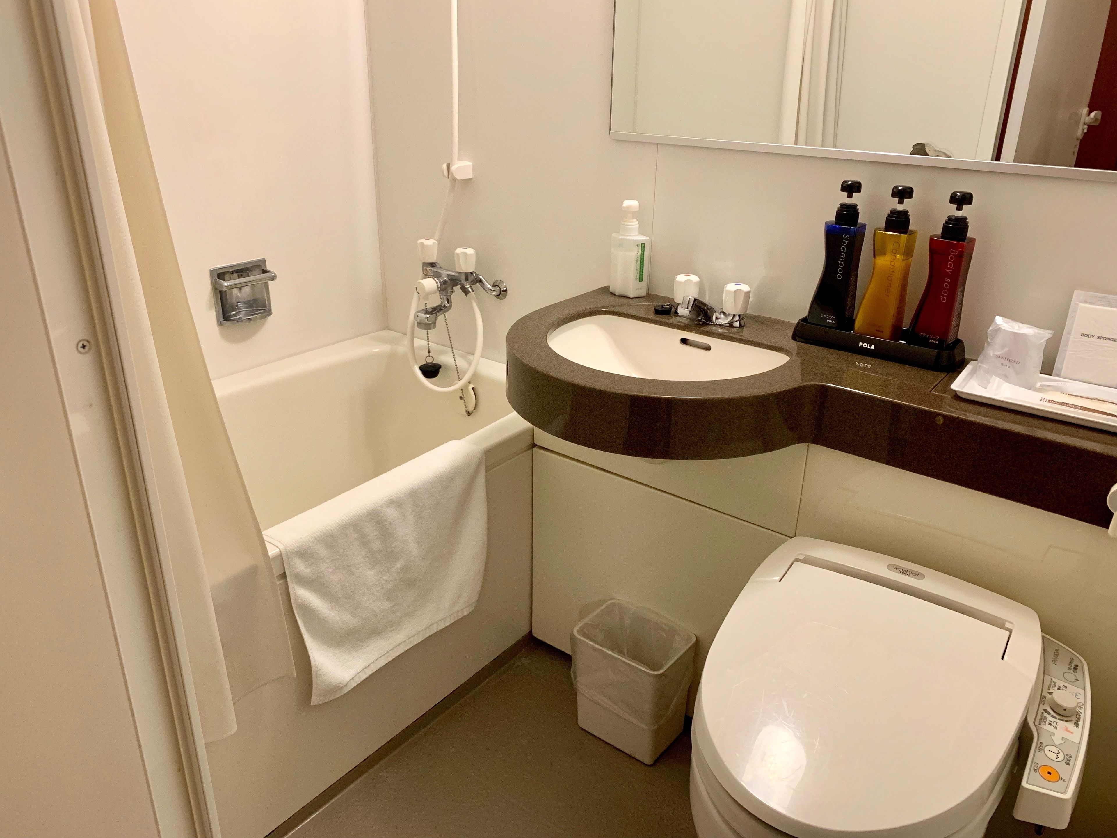 combined shower/bathtub, deep-soaking bathtub, free toiletries, slippers