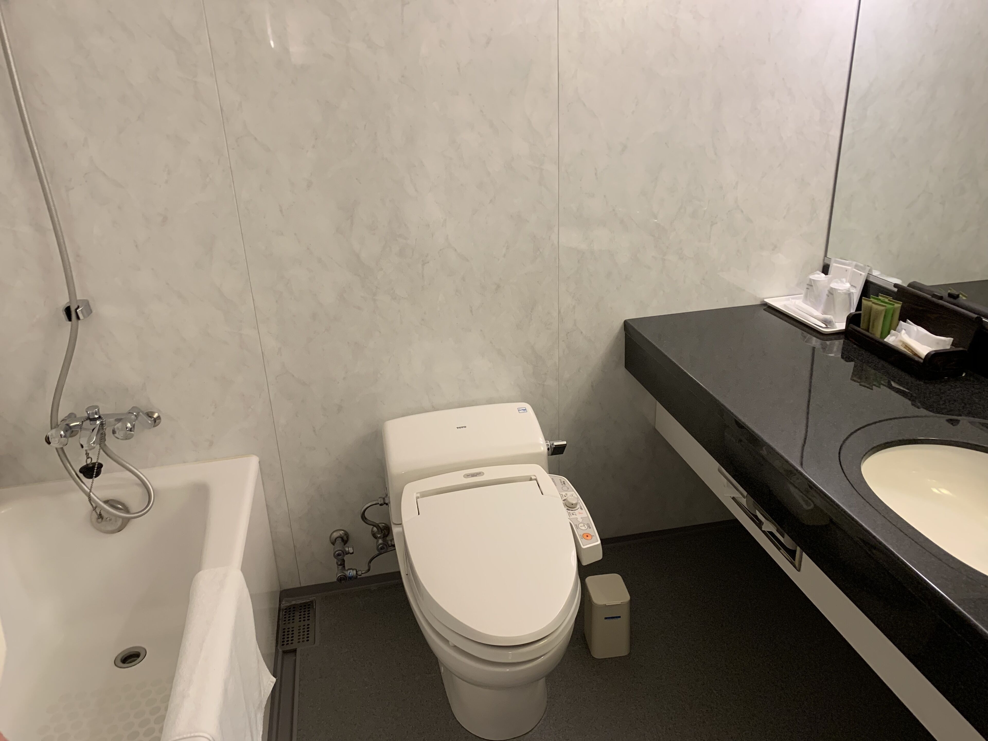 combined shower/bathtub, deep-soaking bathtub, free toiletries, slippers