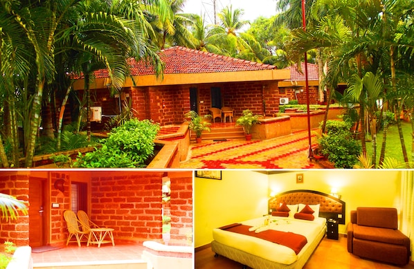 A hotel with a brick exterior, a red-tiled roof, and a garden with palm trees. - Toshali Sands Nature Escape (Puri)