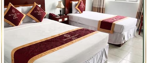 Deluxe Triple Room | 1 bedroom, minibar, desk, laptop workspace