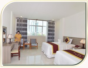 Deluxe Twin Room | Minibar, desk, laptop workspace, blackout curtains