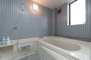 Apartment | Bathroom | Separate tub and shower, free toiletries, hair dryer, slippers