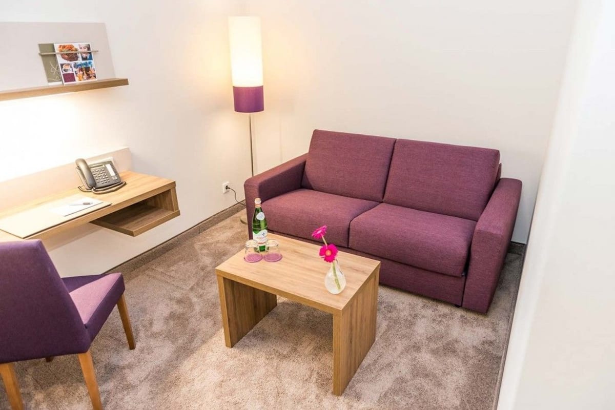 deluxe double room | living area | plasma tv