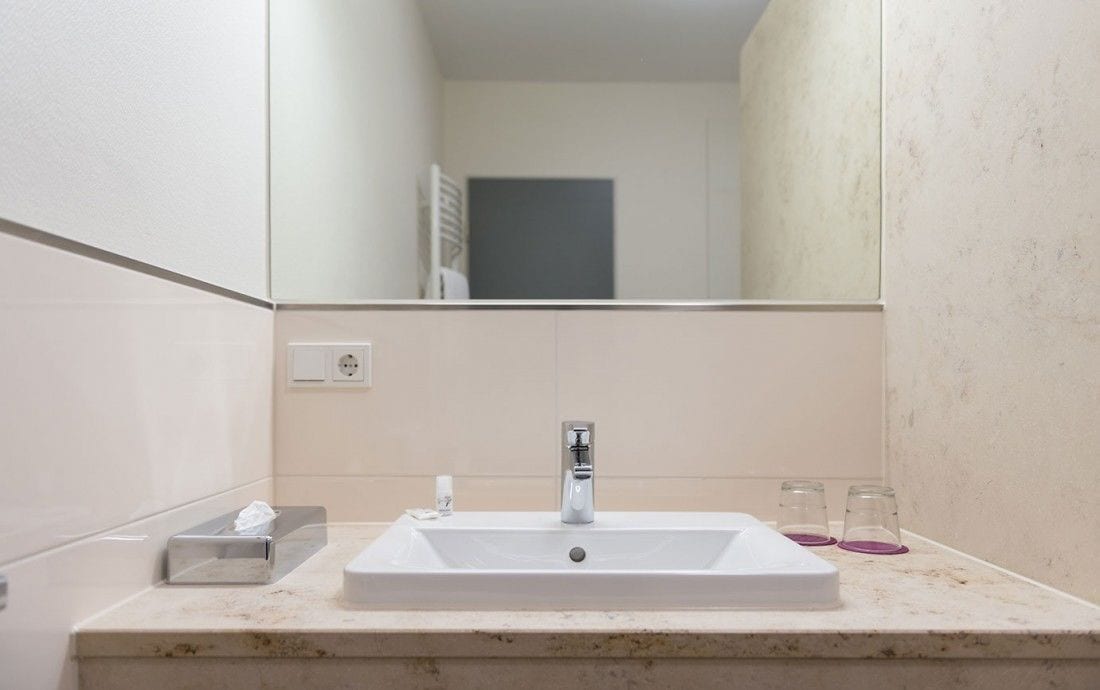 deluxe double room | bathroom | shower, bathrobes, slippers, towels