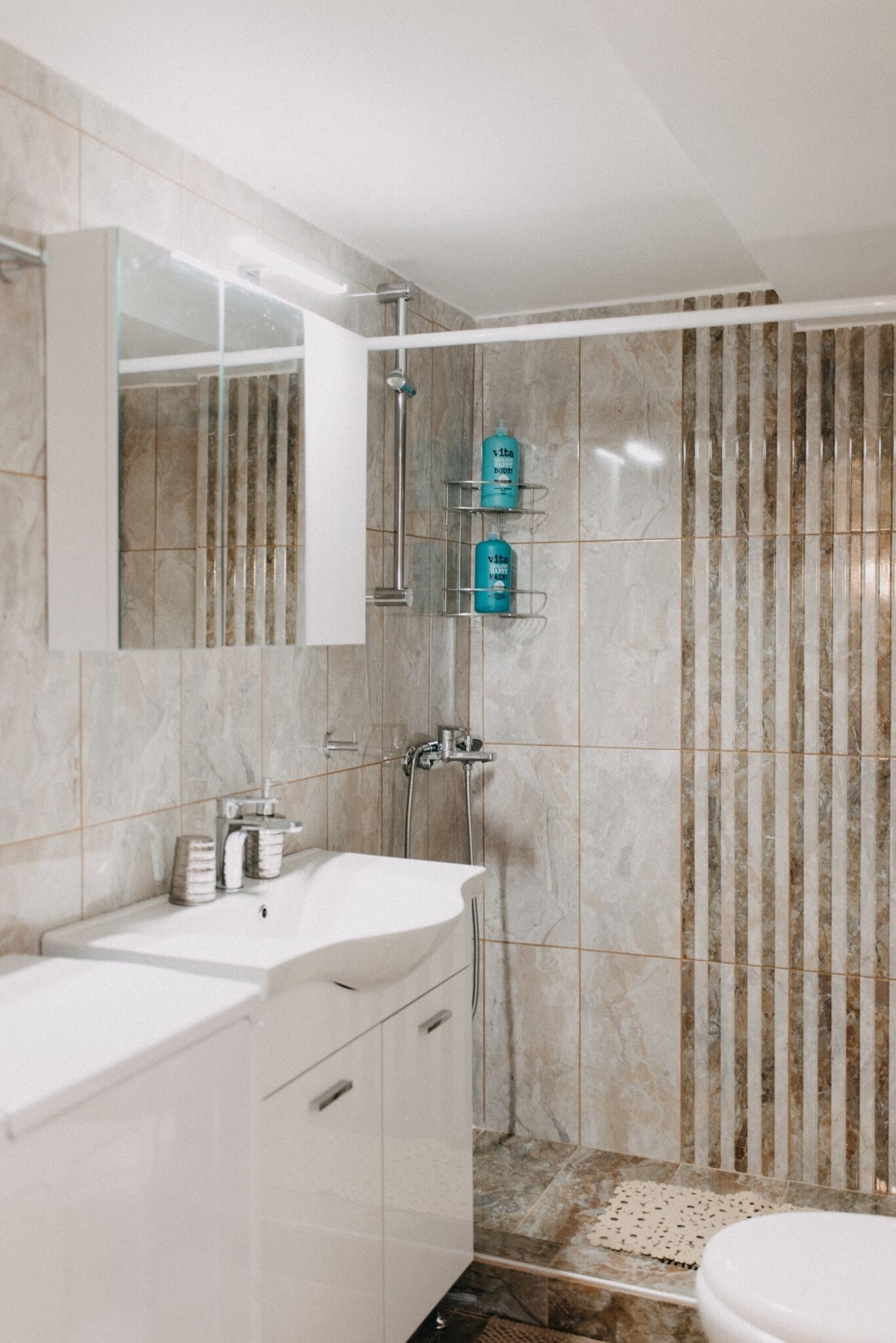 Shower, hair dryer, slippers, towels