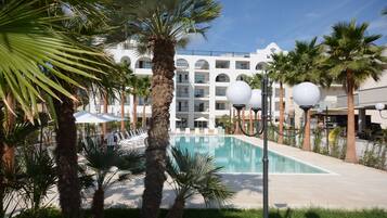 Seasonal outdoor pool, open 9:00 AM to 7:30 PM, pool umbrellas