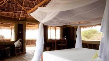 Deluxe Bungalow, Beach View, Beachfront | In-room safe, desk, soundproofing, free WiFi