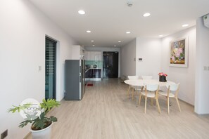 Superior Apartment, 2 Bedrooms | Living area | 49-inch TV with cable channels