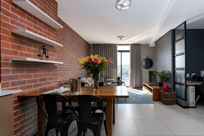 Luxury Apartment (Rose) | Living area | Smart TV - The Rosebank Collection (Johannesburg)
