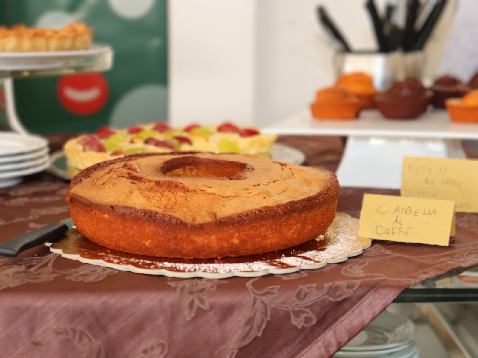 A cake on a table with a label that reads "Cranberry Coffee".