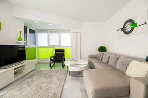 Luxury Apartment | Living area | 65-inch LED TV with cable channels, TV, video-game console - Luxury Westpark 2 Residence Lake View W2 (Bucharest)