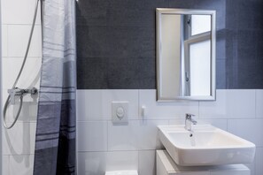 Combined shower/tub, hair dryer, towels, soap