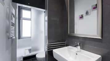Combined shower/bathtub, hair dryer, towels, soap