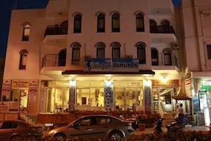 A building with a sign for "Pansiyon" restaurant.