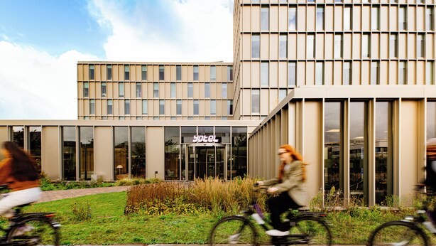 A modern hotel building with a glass facade and a sign reading "yotel". - YOTEL Amsterdam (Amsterdam)