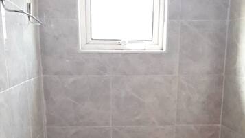 Shower, slippers, towels, soap