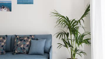 Apartment, 1 Bedroom, Balcony (Dionisio) | Living room | Flat-screen TV