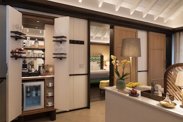 Minimal, elegant suite interior with natural textures