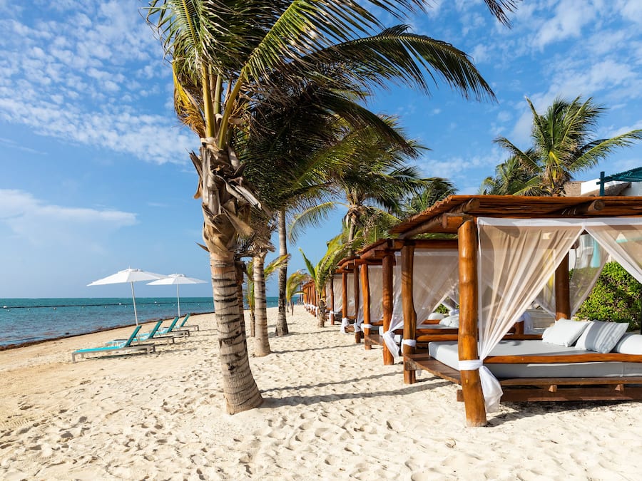 On the beach, beach cabanas, sun loungers, beach umbrellas