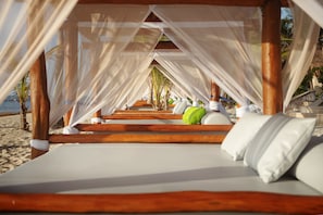 On the beach, beach cabanas, sun loungers, beach umbrellas