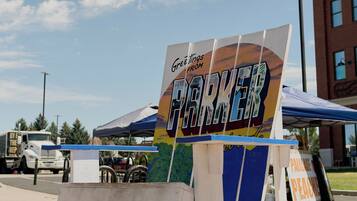 A sign for the Parker Chamber of Commerce with a hashtag #parkercolorado.