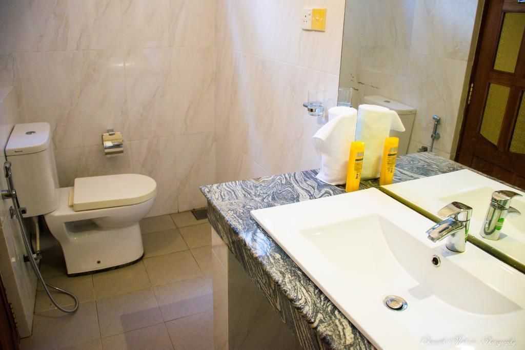 Habitación Deluxe doble | Baño | Ducha y cabezal de ducha con hidromasaje