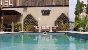 Outdoor pool, open 10:00 AM to 10:00 PM, pool umbrellas, pool loungers