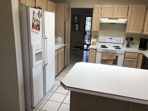 Microwave, dishwasher, coffee/tea maker, cookware/dishes/utensils